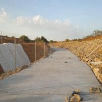 09 etat final piste larache apres enrochement tout venant bassin et beton b25 avec ferraillage